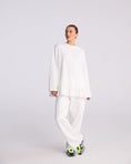 Load image into Gallery viewer, Stieglitz Brisa Skate Longlseeve met ruffle - wit
